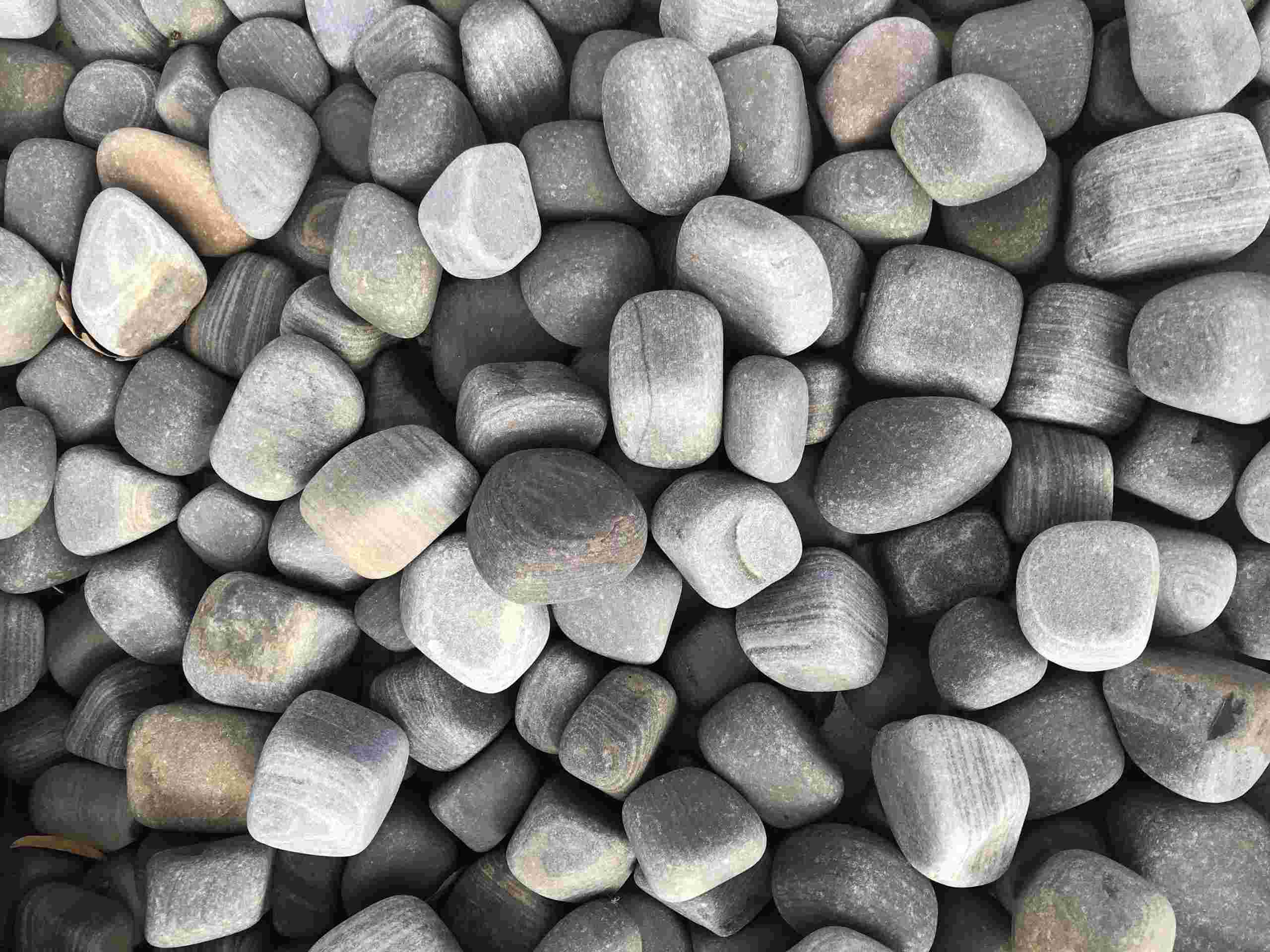 https://www.foras.co.uk/app/uploads/2020/05/Shark-Sandstone-Pebbles-scaled.jpg